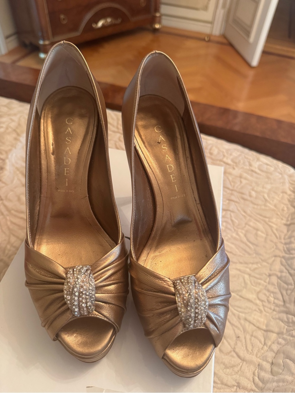Casadei Gold Leather Peep-Toe Heels with Crystal Knot